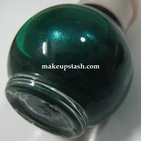 The dark green hue of the nail polish was quite attractive on the counter,